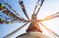 Prayer flags flying against the sun from the Boudhanath Stupa Royalty Free Stock Photo