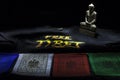 Prayer flags with Free Tibet t-shirt and buddha statue Royalty Free Stock Photo