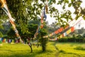 Prayer flags hanging at garden in Lumbini, Nepal Royalty Free Stock Photo