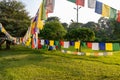 Prayer flags hanging at garden in Lumbini, Nepal Royalty Free Stock Photo