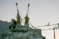 Prayer flags mounted on old pillars