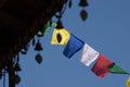 Prayer flags wave in the wind at a Buddhist temple Royalty Free Stock Photo
