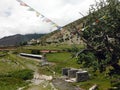 Prayer Flags and Wheels near a Small Himalayan Town Royalty Free Stock Photo