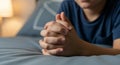 Prayer Hand of Young Believer Folded Gently in Bedtime Devotion and Peaceful Reflection Moment-(AI Generated) Royalty Free Stock Photo