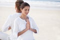 Prayer hands, couple and meditation on beach for zen and wellness with holistic healing outdoor for calm and yoga. Ocean