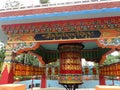 Prayer mill in tibetan refuge village in Rabgayling in Karnataka, India Royalty Free Stock Photo