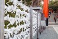 Prayer Papers Tied to Rope in Japanese Shrine - Spiritual Tradition and Sacred Offerings