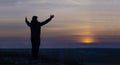 Prayer. Repentance. A man with his hands raised against the sky. Pray to God. Worship, against the backdrop of sunset Royalty Free Stock Photo