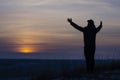 Prayer. Repentance. A man with his hands raised against the sky. Pray to God. Worship, against the backdrop of sunset Royalty Free Stock Photo