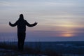 Prayer. Repentance. A man with his hands raised against the sky. Pray to God. Worship, against the backdrop of sunset Royalty Free Stock Photo