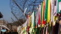 Prayer ribbons attached to a barb wire fence at the Korean Demilitarized Zone