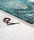 Prayer rug and rosary for worshiping in the month of Ramadan Royalty Free Stock Photo