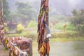 Prayer tags tied to a pole on the bridge in the Pilok mine village in kanchanaburi City Thailand.