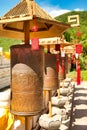 Buddhist prayer wheels in front of the temple are jade-gold statues of the goddess Guanyin in the Nanshan Buddhism Center. Hainan,