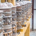 Prayer wheels in the buddhist temple Royalty Free Stock Photo