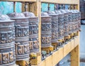 Prayer wheels in the buddhist temple Royalty Free Stock Photo