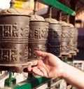 Prayer wheels and a hand