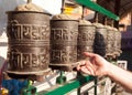 Prayer wheels and a hand
