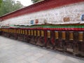 Prayer wheels out the wall of the Potala Palace in Tibet