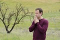 Praying alone in an empty field.