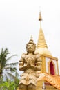 Praying angel statue beside the buddhist pagoda Royalty Free Stock Photo