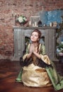 Praying beautiful woman in medieval dress Royalty Free Stock Photo