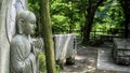 Praying Buddha statue in the Japanese garden in Tokyo (Japan) Royalty Free Stock Photo