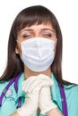 Praying female medical doctor with mask isolated