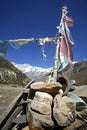 Praying flags and stones in annapurna Royalty Free Stock Photo