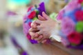 Praying hands at alter during church wedding Royalty Free Stock Photo