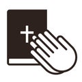 Praying hands and bible