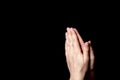 Praying hands with faith in religion and belief in God on blessing background. Power of hope or love and devotion in the dark with Royalty Free Stock Photo