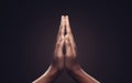 Praying hands with faith in religion and belief in God on dark background. Power of hope or love and devotion. Namaste or Namaskar Royalty Free Stock Photo