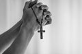 Praying hands holding a rosary. Royalty Free Stock Photo