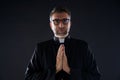 Praying hands priest portrait of male