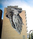 Praying Hands Street Art On Side of Building in Athens, Greece