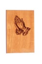 Praying hands on wood