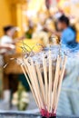 Praying joss stick burns in the compound of a budd Royalty Free Stock Photo