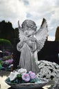 Praying angel figurine on the grave Royalty Free Stock Photo