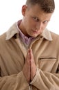 Praying male looking at camera Royalty Free Stock Photo