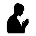 Praying man black silhouette on white background Royalty Free Stock Photo