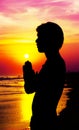 Praying man on sunset Royalty Free Stock Photo