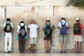 Praying men at Western wall in Jerusalem, Israel