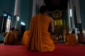 Monks praying in a buddhist temple