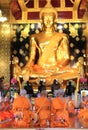 Praying Monks at Wat Phra Si Rattana Mahathat temple. Wat Yai is
