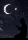 Muslim at night and hilal symbol