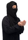 Praying muslim woman in hijab over white