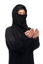 Praying muslim woman in hijab over white