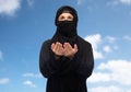 Praying muslim woman in hijab over white