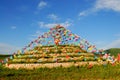 Praying stone and prayer flags on steppe